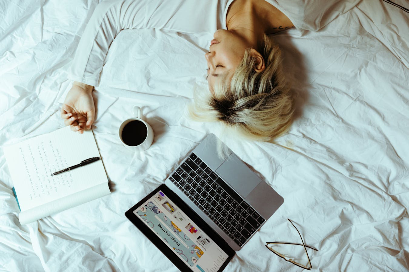 Woman resting on a desk showing daytime fatigue that may benefit from schisandra berry for adrenal fatigue