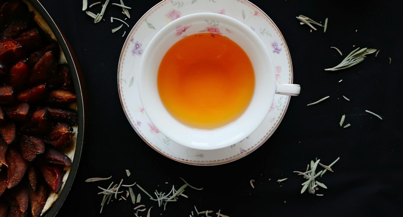 A delicate cup of warm ume plum tea on a traditional Japanese setting