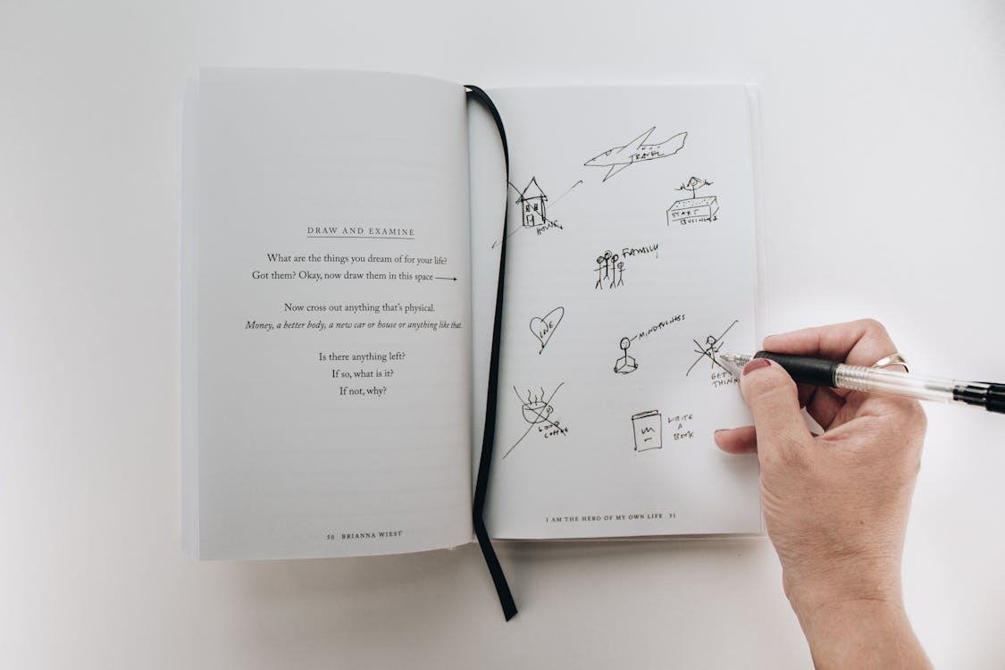 Person writing daily for five minute journal vs bullet journal anxiety relief