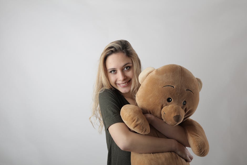 Adult holding plush comfort object