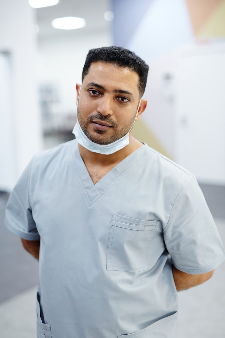 Dentist examining patient teeth during preparation for SMART-protocol amalgam removal