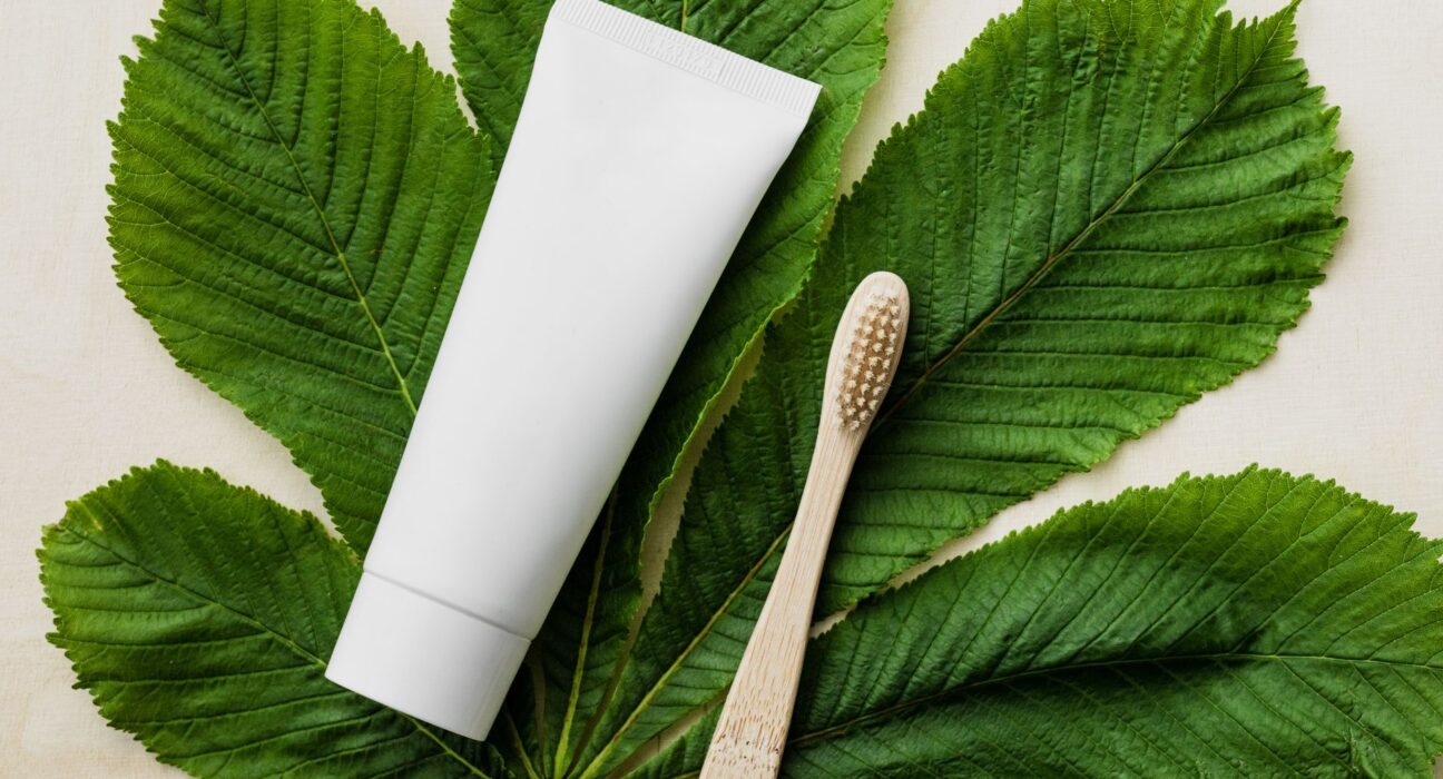 Natural toothpaste tube and eco-friendly bamboo toothbrush, the homemade alternative to commercial paste